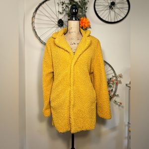 Yellow Stoosh teddy coat with hidden snap buttons